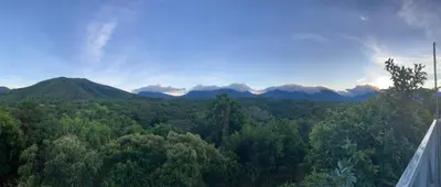 a view of a forest with mountains in the background at Villas Oasis Verde in Salcoatitán