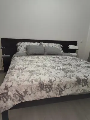 a bedroom with a bed with a floral bedspread at Luxury Cozy Home in San Miguel