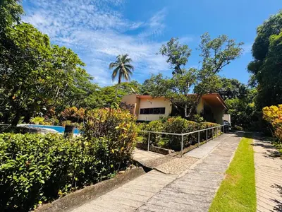 a walkway leading to a house and a pool at Essenz Bahía in El Níspero