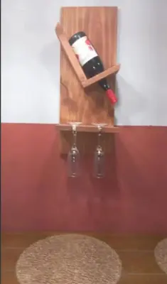 a bottle of wine in a wooden holder on a wall at Casa completa, cómoda y céntrica in San Salvador