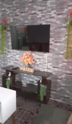 a rendering of a living room with a stone wall at Casa completa, cómoda y céntrica in San Salvador