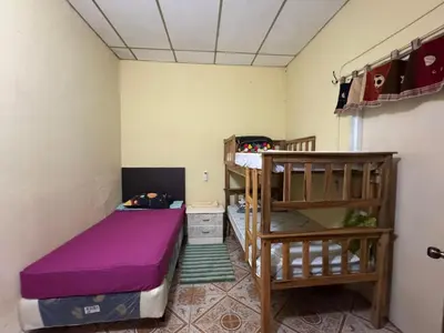 a small room with two bunk beds in it at Relax House in Sonsonate