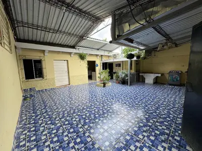 a room with a blue tile floor in a building at Relax House in Sonsonate