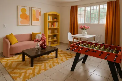 a living room with a foosball table and a couch at Galería living in San Salvador