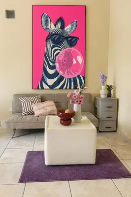 a living room with a zebra holding a pink donut at Galería living in San Salvador