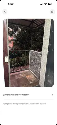 an open door to a balcony with a fence at Apartamento estadio CUSCATLAN in San Salvador