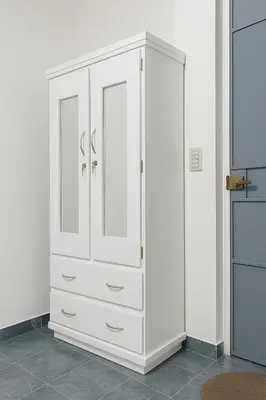 a white cabinet with two doors in a room at Suite Linda Vista Descanso y Naturaleza in San Marcos