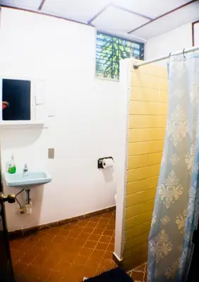 a bathroom with a shower and a sink at Rancho Mayayi Beach house in San Miguel