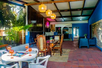 a patio with tables and chairs and a dining room at Rancho Mayayi Beach house in San Miguel
