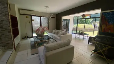 a living room with a couch and a table at Casa Miramar, relaxation and work