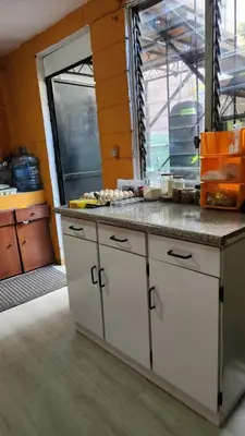 a kitchen with a counter top in a room at Casa en Altos del Cerro in Soyapango