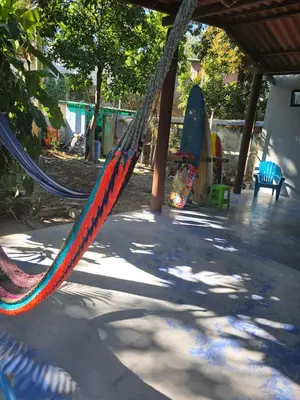 a hammock in a playground with skateboards on it at Surf House