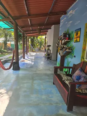 a living room with a couch and a playground at Surf House