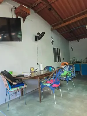 a room with a wooden table and chairs at Surf House