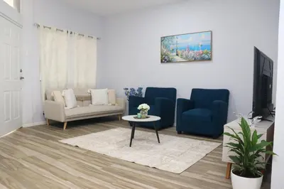 a living room with a couch and a table at Casa Veraneras in Santa Ana