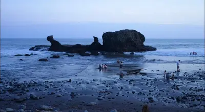 a group of people standing on a beach at Casa Veraneras in Santa Ana