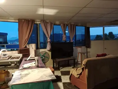 a living room with a view of the city at Habitaciones Clásica en lo mejor de SS city in San Salvador