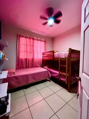 a bedroom with two bunk beds and a ceiling fan at Apartment near to the best San Salvador areas in San Salvador