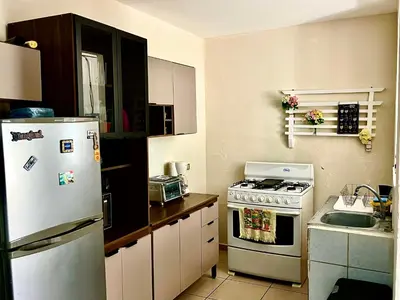 a kitchen with a refrigerator and a stove at Apartment near to the best San Salvador areas in San Salvador