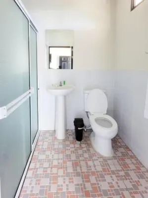 a bathroom with a toilet and a sink at Hotel Sweet Dreams in La Unión