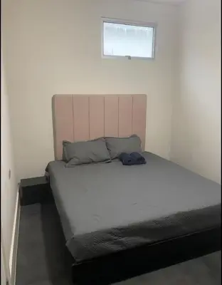 a bed in a small room with at Casa Cristal in San Luis La Herradura