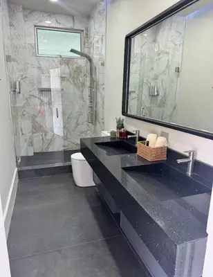 a bathroom with two sinks and a shower at Casa Cristal in San Luis La Herradura
