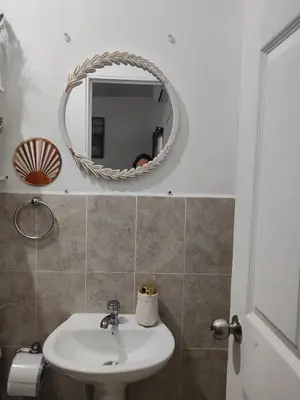 a bathroom with a sink and a mirror at Sunzal Loft, ISA Ecovilla Surfing in El Sunzal