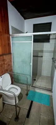 a bathroom with a shower and a toilet at Habitación Lomas de San Francisco in San Salvador