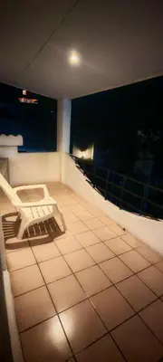 a balcony with a bench in a room with a view at Habitación Lomas de San Francisco in San Salvador