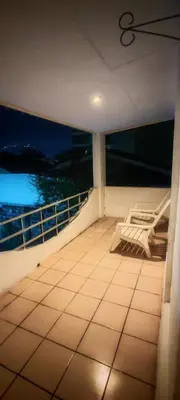 a balcony of a boat with a view of the water at Habitación Lomas de San Francisco in San Salvador