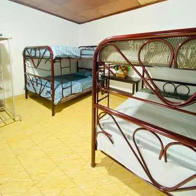 a group of bunk beds in a room at Hostal La casa de Ross in Santa Ana