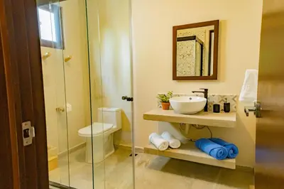 a bathroom with a sink and a toilet at 2Surf Sunzal in El Sunzal