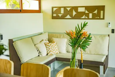 a living room with a couch and a table at 2Surf Sunzal in El Sunzal