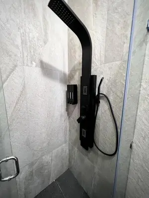 a phone on the wall of a shower in a bathroom at Quinta Avanti Villa-Coatepeque Lake-14 guest in Santa Ana