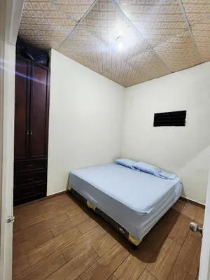 a bedroom with a bed in a room at House Moma