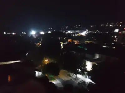 a view of a city at night with lights at Apartamento YOU D6 in San Salvador