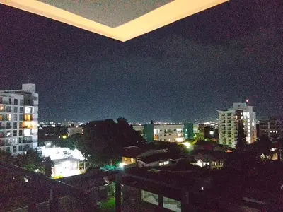 a view of a city skyline at night at Apartamento YOU D6 in San Salvador