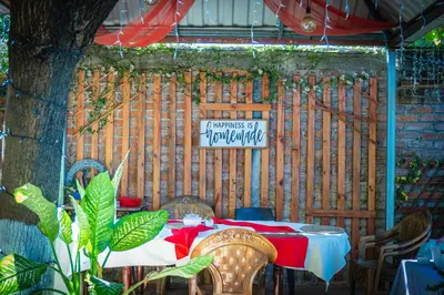 a table with a red and white table cloth and a sign at Hotel D' Palacio Real in San Miguel
