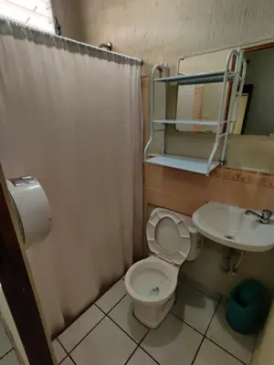 a small bathroom with a toilet and a sink at Hotel en Santa Ana in Santa Ana