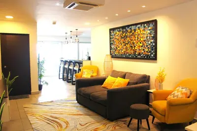 a living room with a couch and two chairs at Kailani, Costa del Sol in San Luis La Herradura