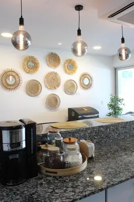 a kitchen with a counter top with some pots and pans at Kailani, Costa del Sol in San Luis La Herradura