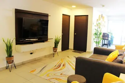 a living room with a large flat screen tv at Kailani, Costa del Sol in San Luis La Herradura