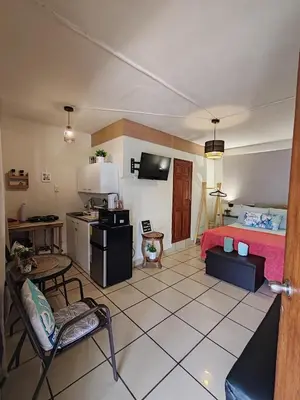 a living room with a bed and a kitchen at Cozy Loft,Surf City, La Libertad, in La Libertad