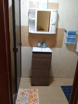 a small bathroom with a sink and a mirror at Cozy Loft,Surf City, La Libertad, in La Libertad