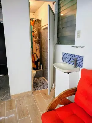 a bathroom with a shower and a sink and a toilet at Lombardia San Salvador City in San Salvador