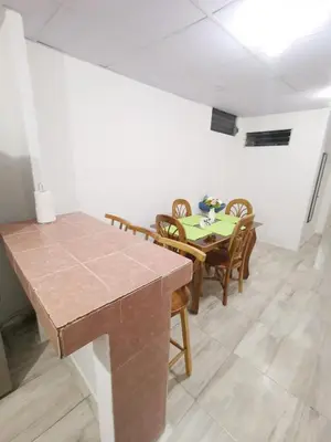 a dining room with a table and chairs at Casa céntrica en zona privada in Las Delicias