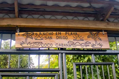 a sign hanging from the roof of a restaurant at Coco Cabana en Playa San Diego in San Diego