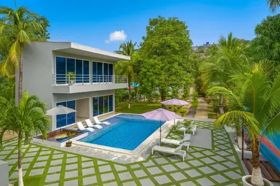 an aerial view of a house with a swimming pool at Kosta Brava Hotel y Restobar in El Majahual