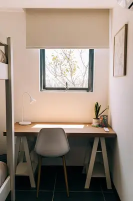 a desk with a chair and a window in a room at NEW Cozy&Modern Apt 30min from SurfCity in Hacienda Plan de La Laguna