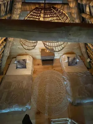 an overhead view of a bed in a room at hotel nativo san blas in Playa San Blas